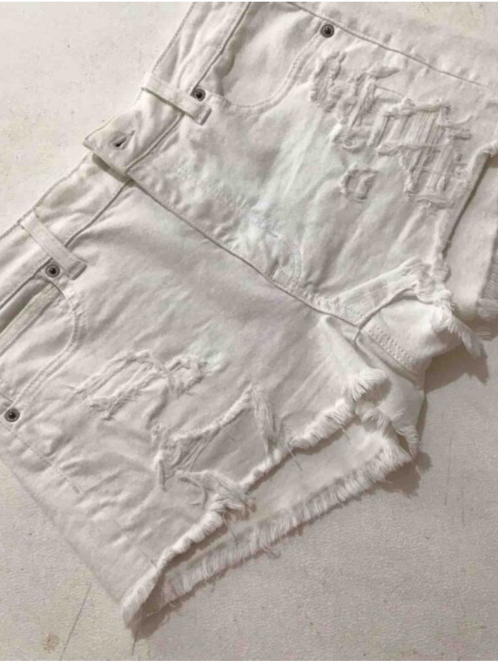 White Distressed High-Rise Denim Cutoff Shorts